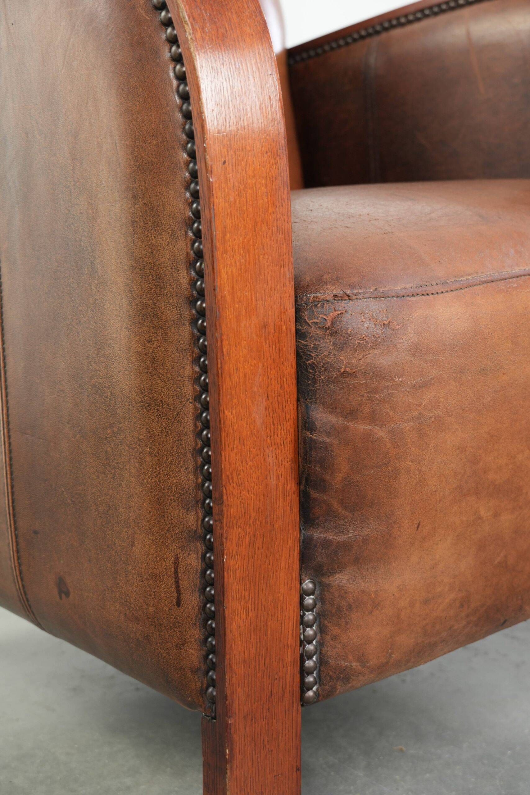 Sheepskin armchair in Art Deco style with wooden armrests