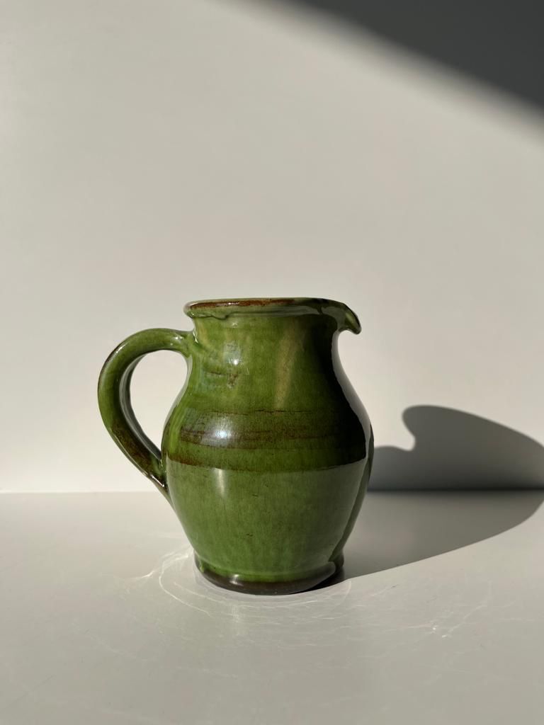 Green glazed ceramic pitcher
