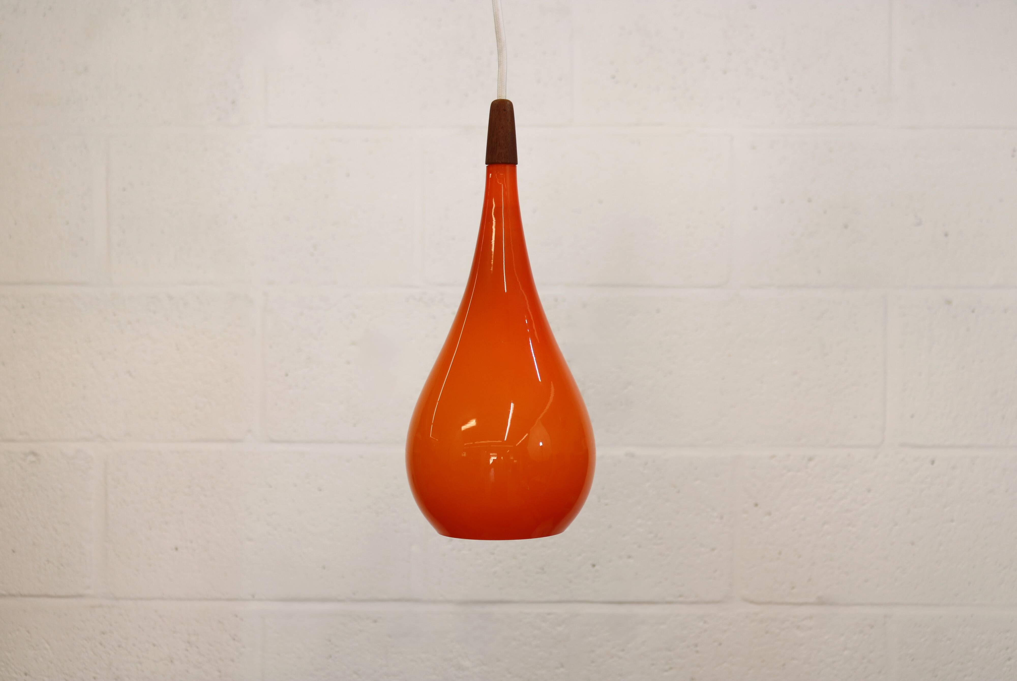 Orange teardrop glass pendant lamp made by Holmegaard - Denmark 1960