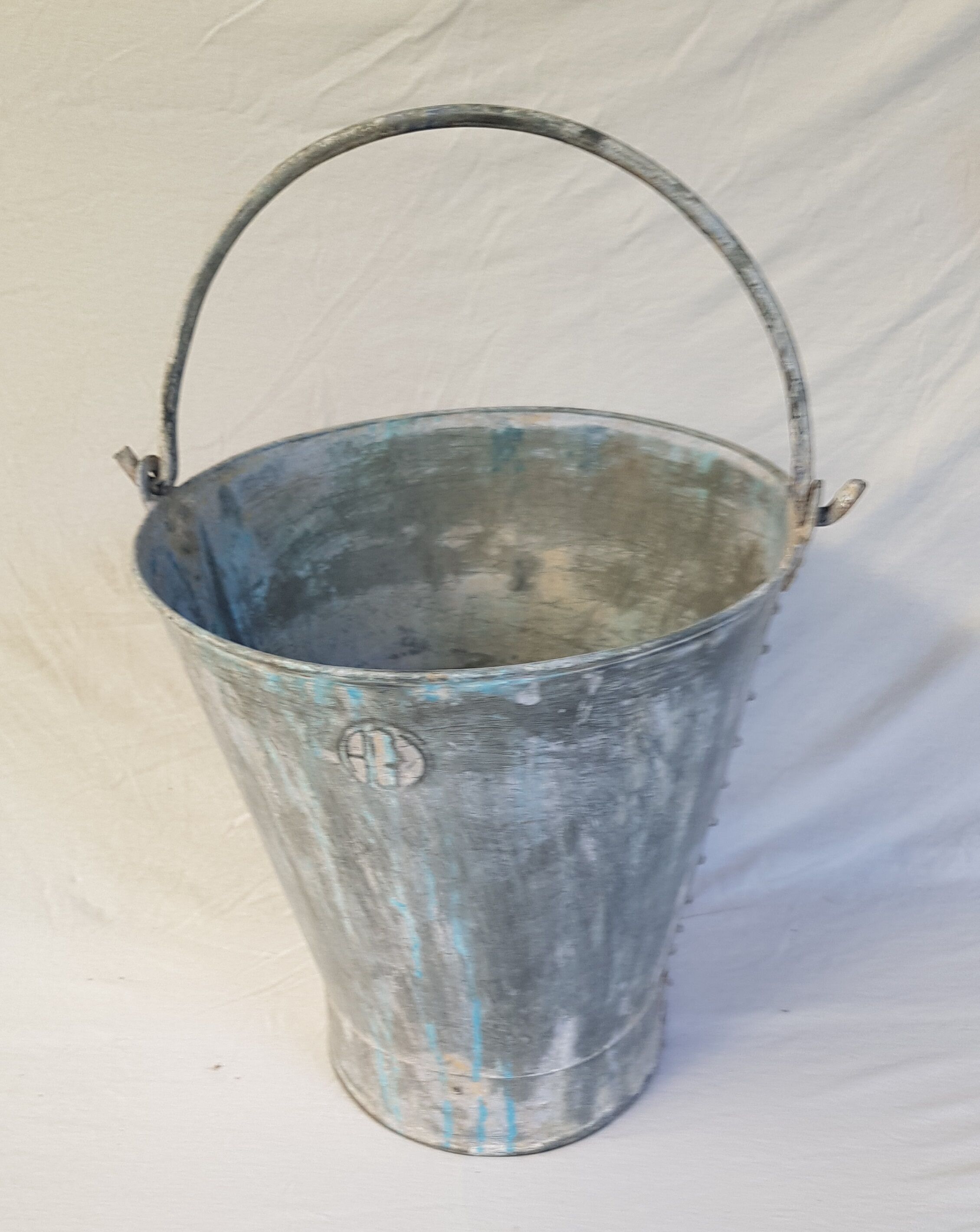 Old bucket with thick zinc handle