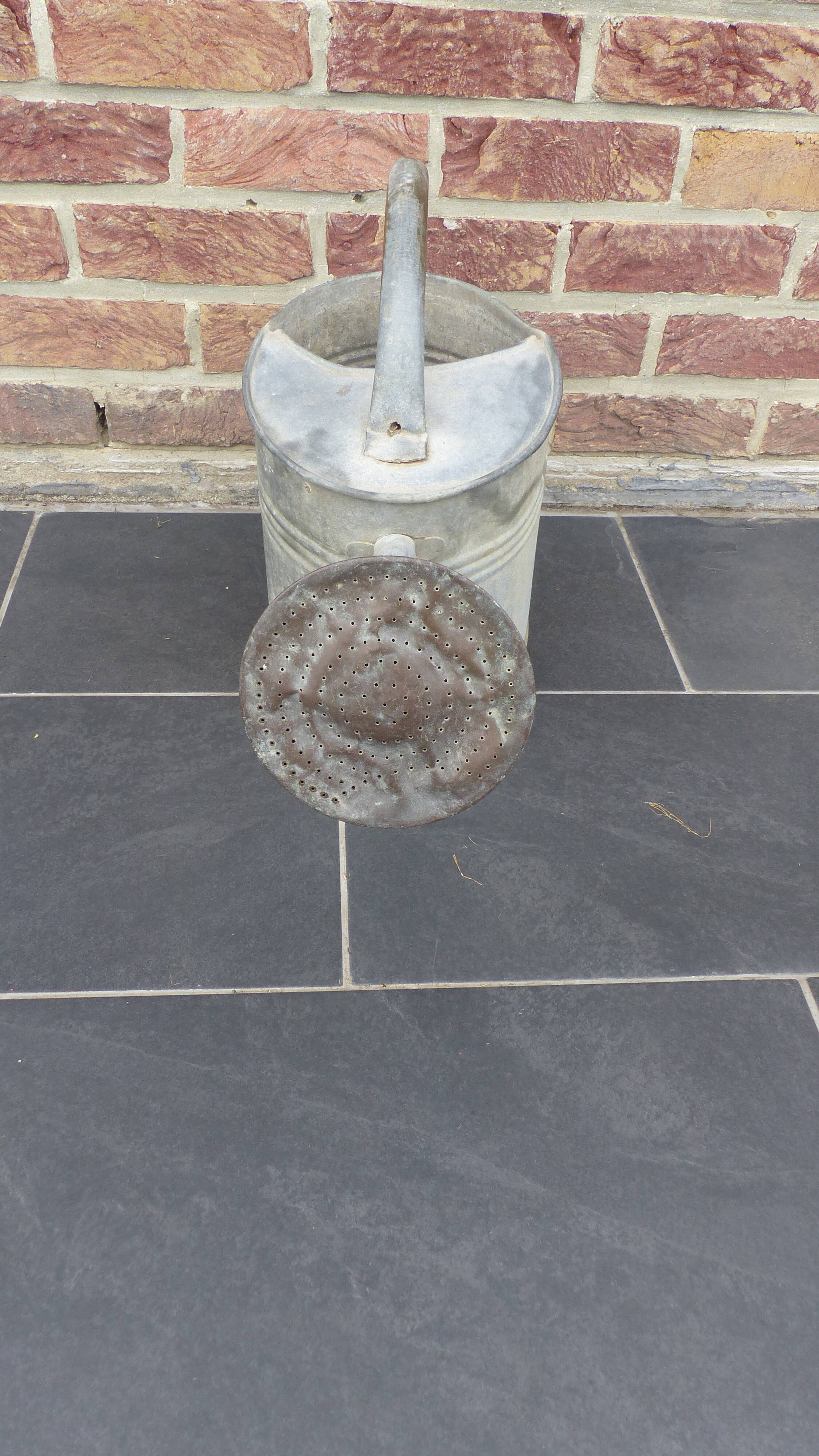 Zinc watering can with its apple