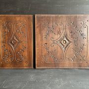 Pair of antique decorative panels in carved wood, late 19th century.