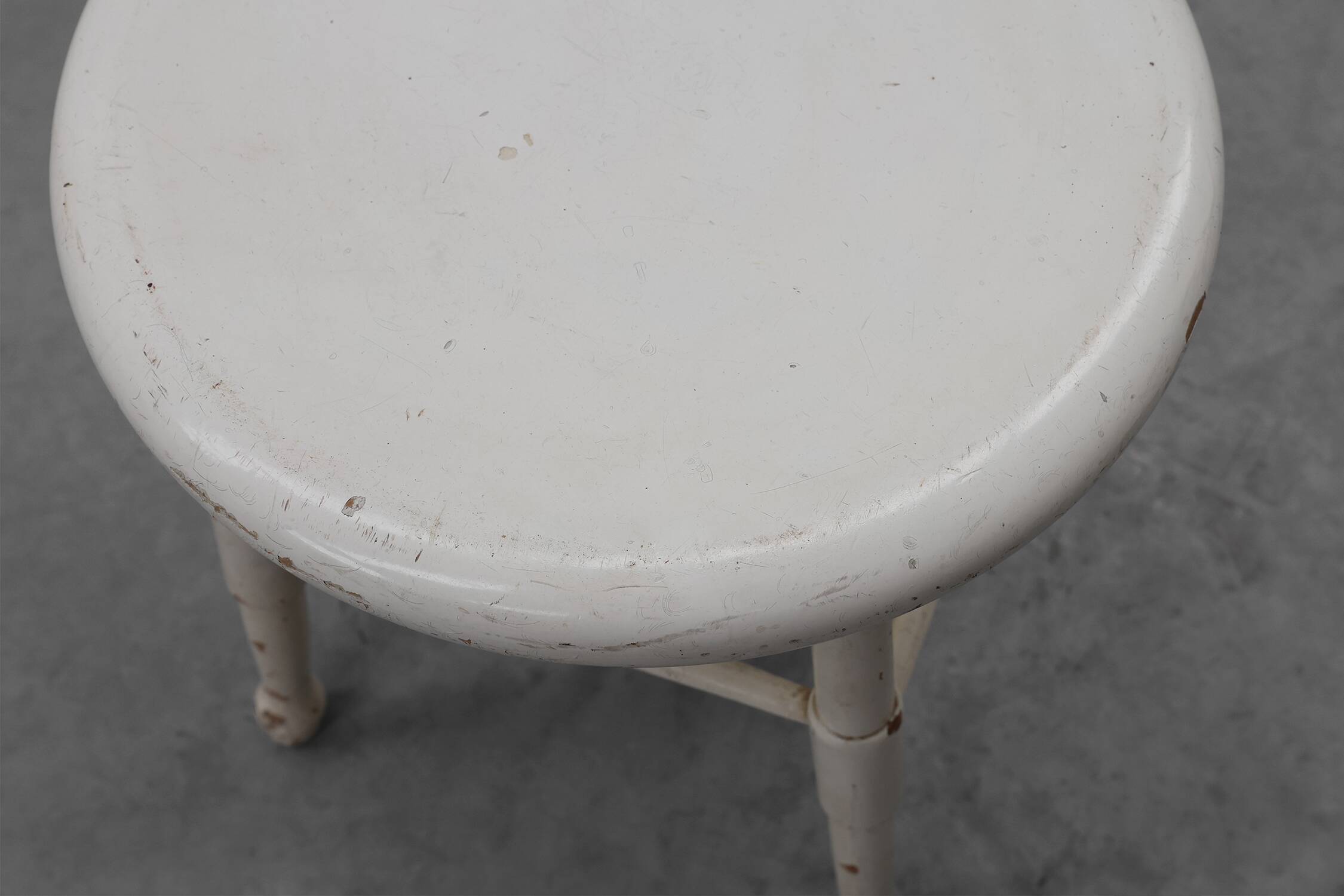 Rustic white wooden low farm stool, France ca. 1920