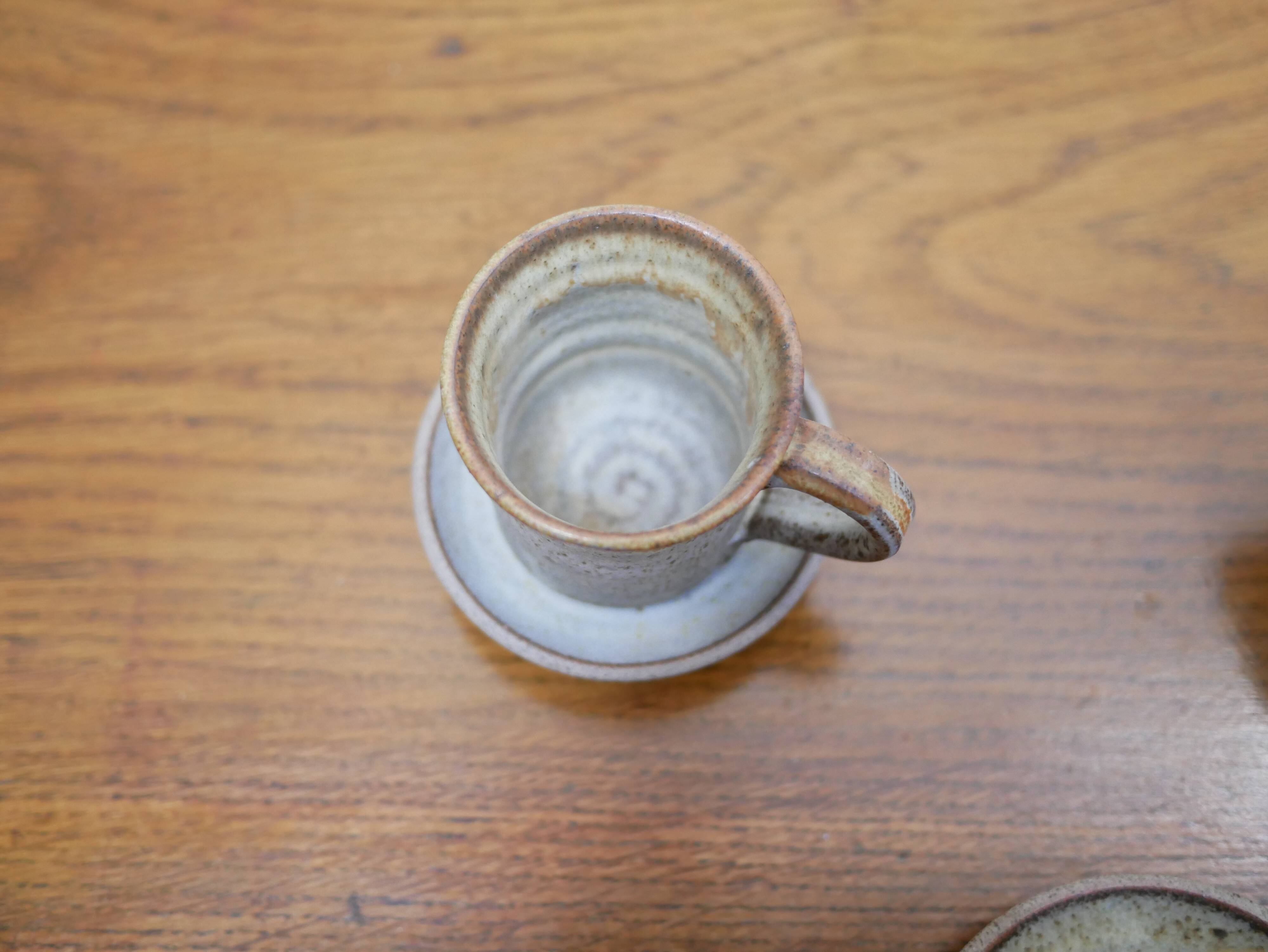 Series of 4 cups and a vintage stoneware milk jug