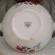 Mismatched old soup plates accompanied by a soup tureen