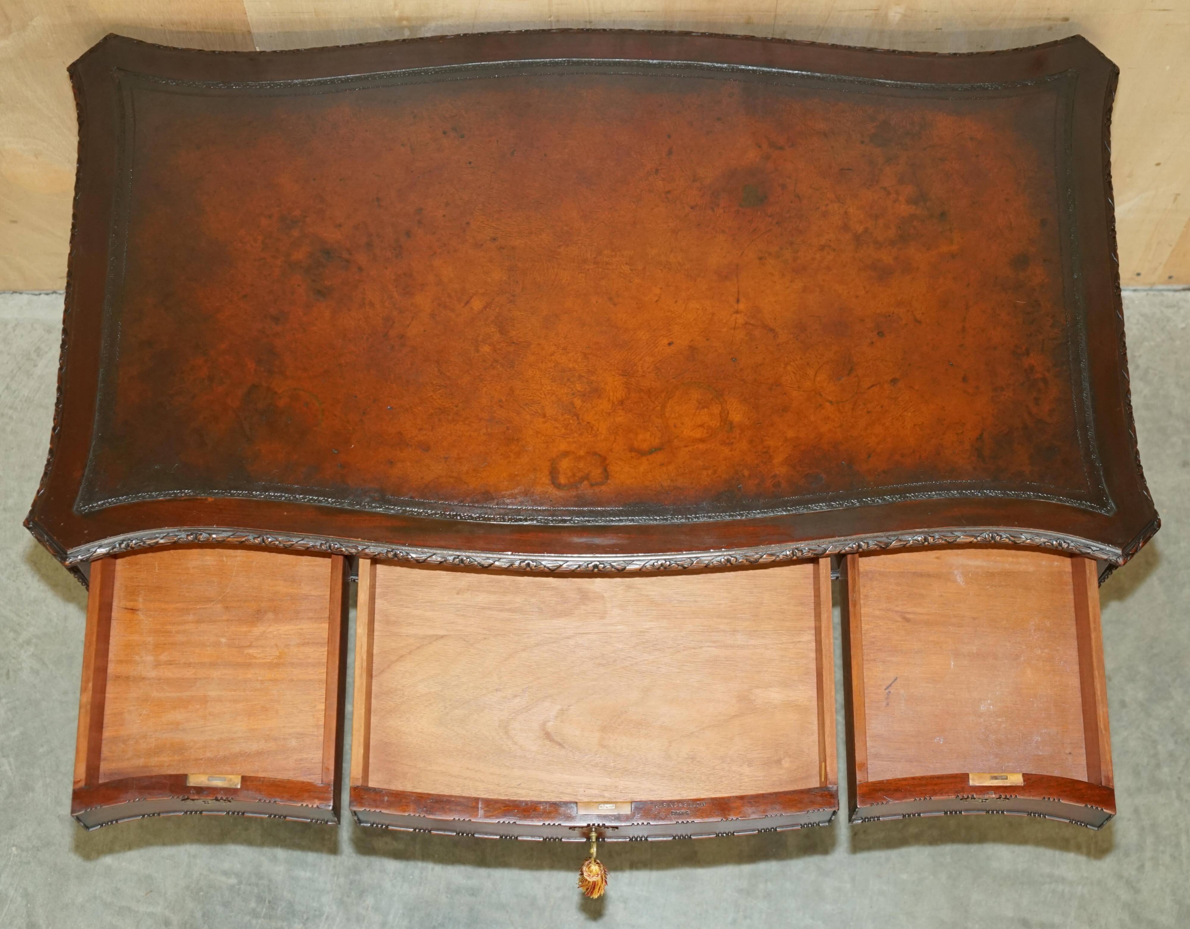 WARING & GILLOW library desk in the style of Thomas Chippendale with a leather top.