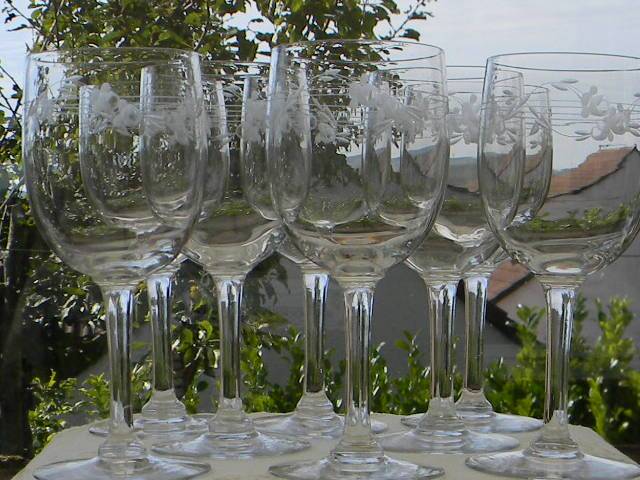 Set of 8 antique glass water glasses. Engraved floral border