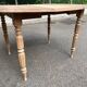 Renovated 18th century solid wood extendable round dining table with shutters