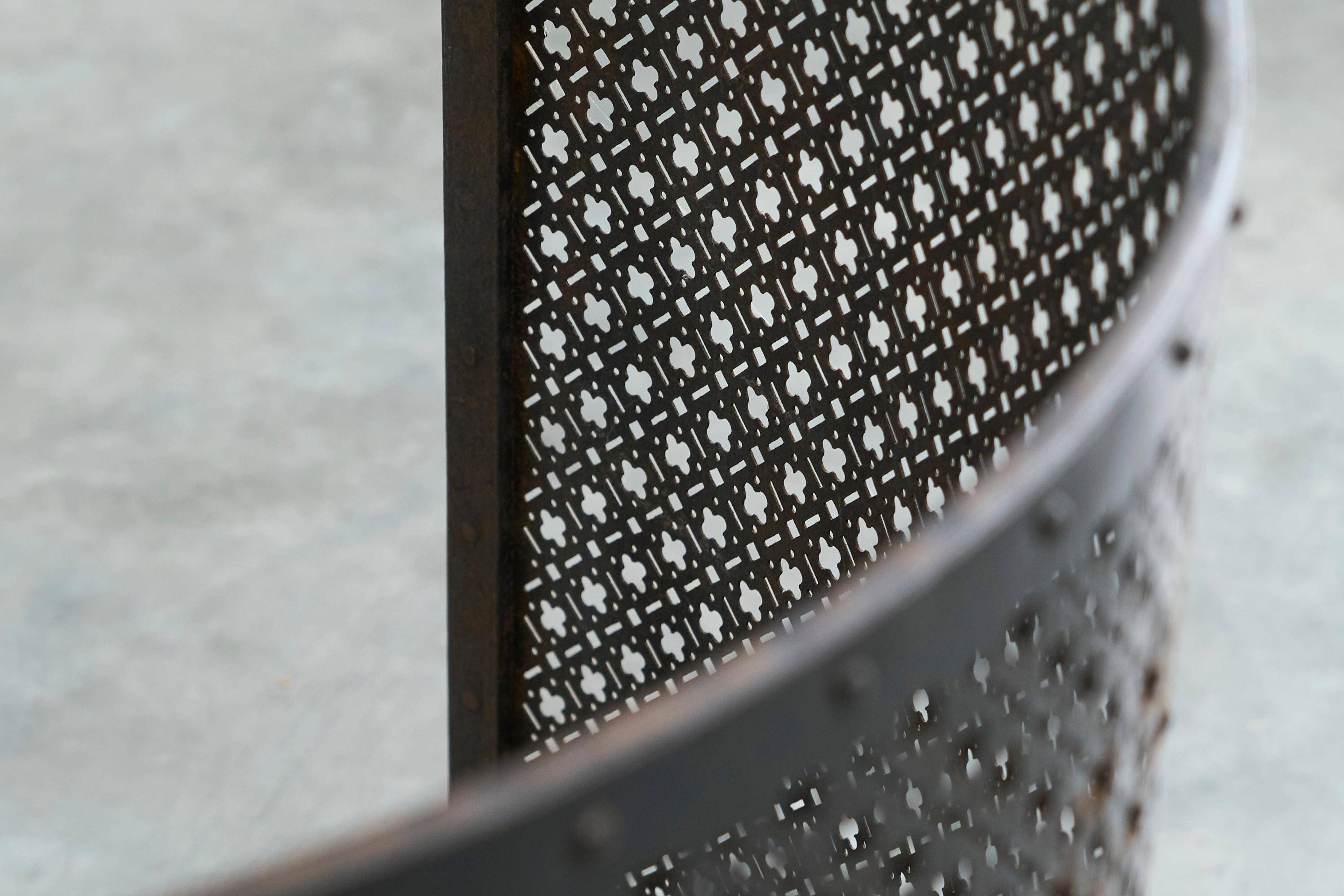 Half-moon antique wrought iron fire screen from the 19th century.