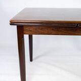 Dining table in rosewood with extentions, of danish design from the 1960s.