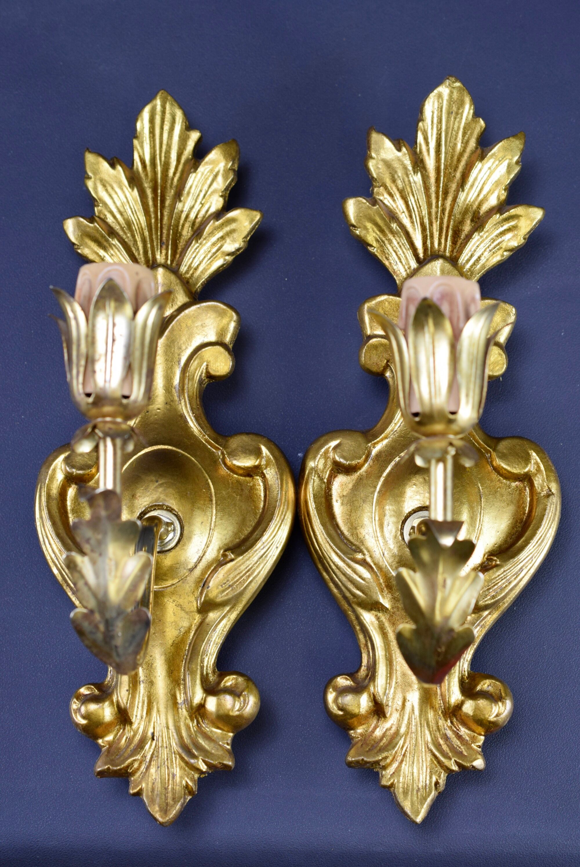 Pair of walled carved wood wall lamps