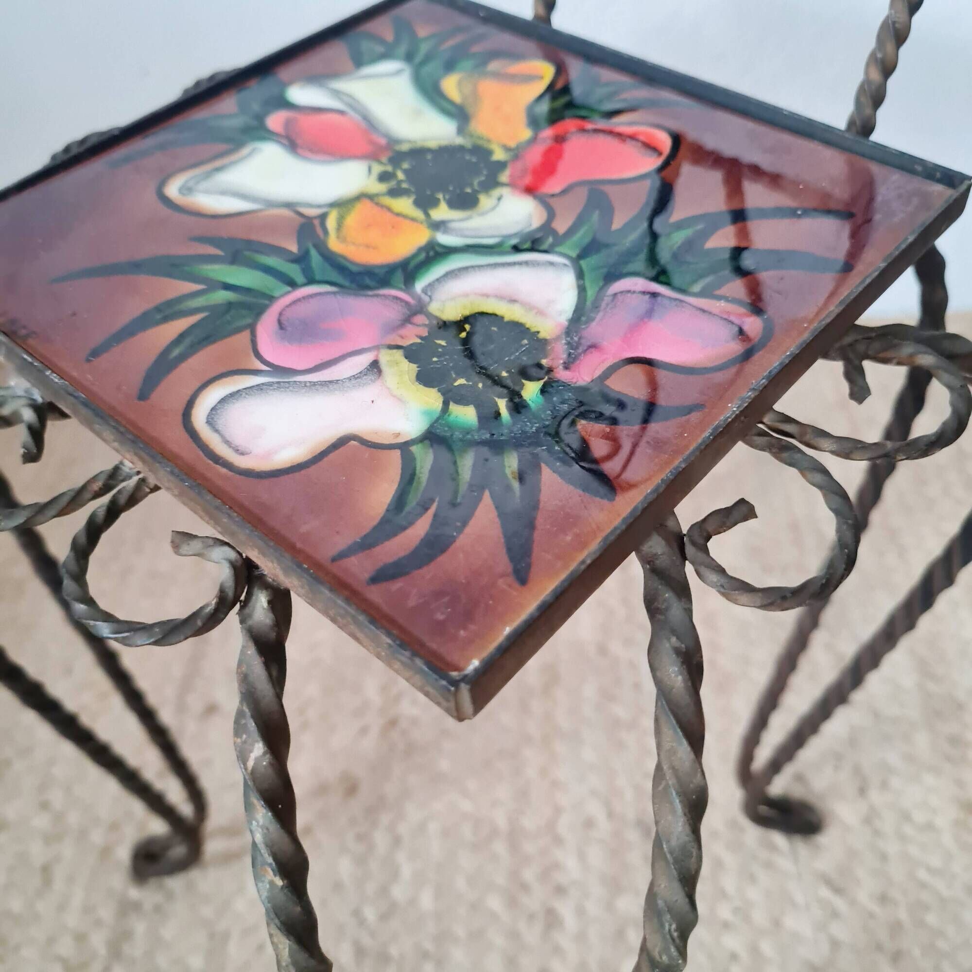 Small chair / stool in twisted wrought iron and floral ceramic.