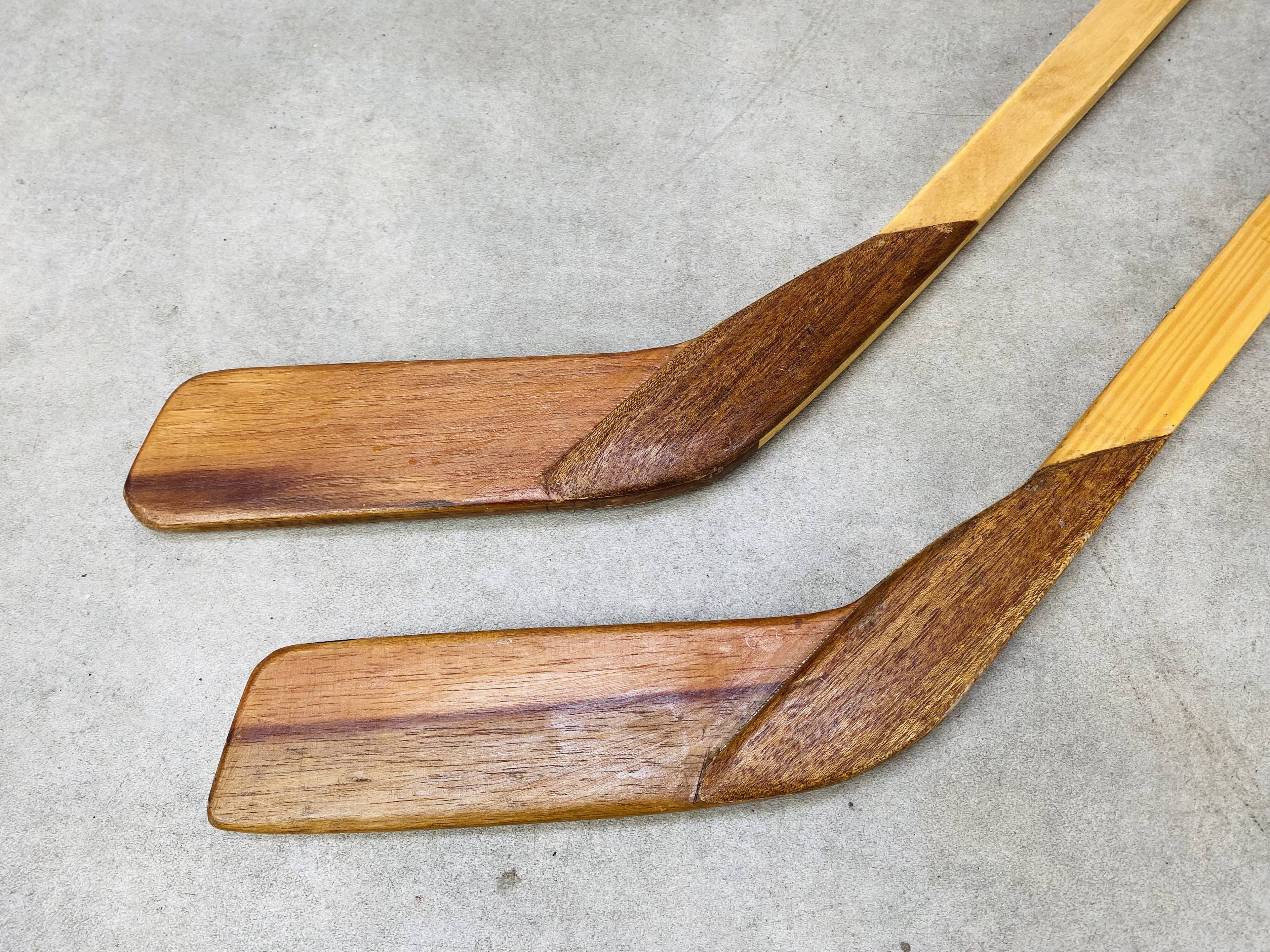 Pair of vintage wood hockey sticks