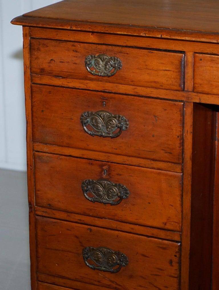 Small Victorian desk in solid walnut with drawers.