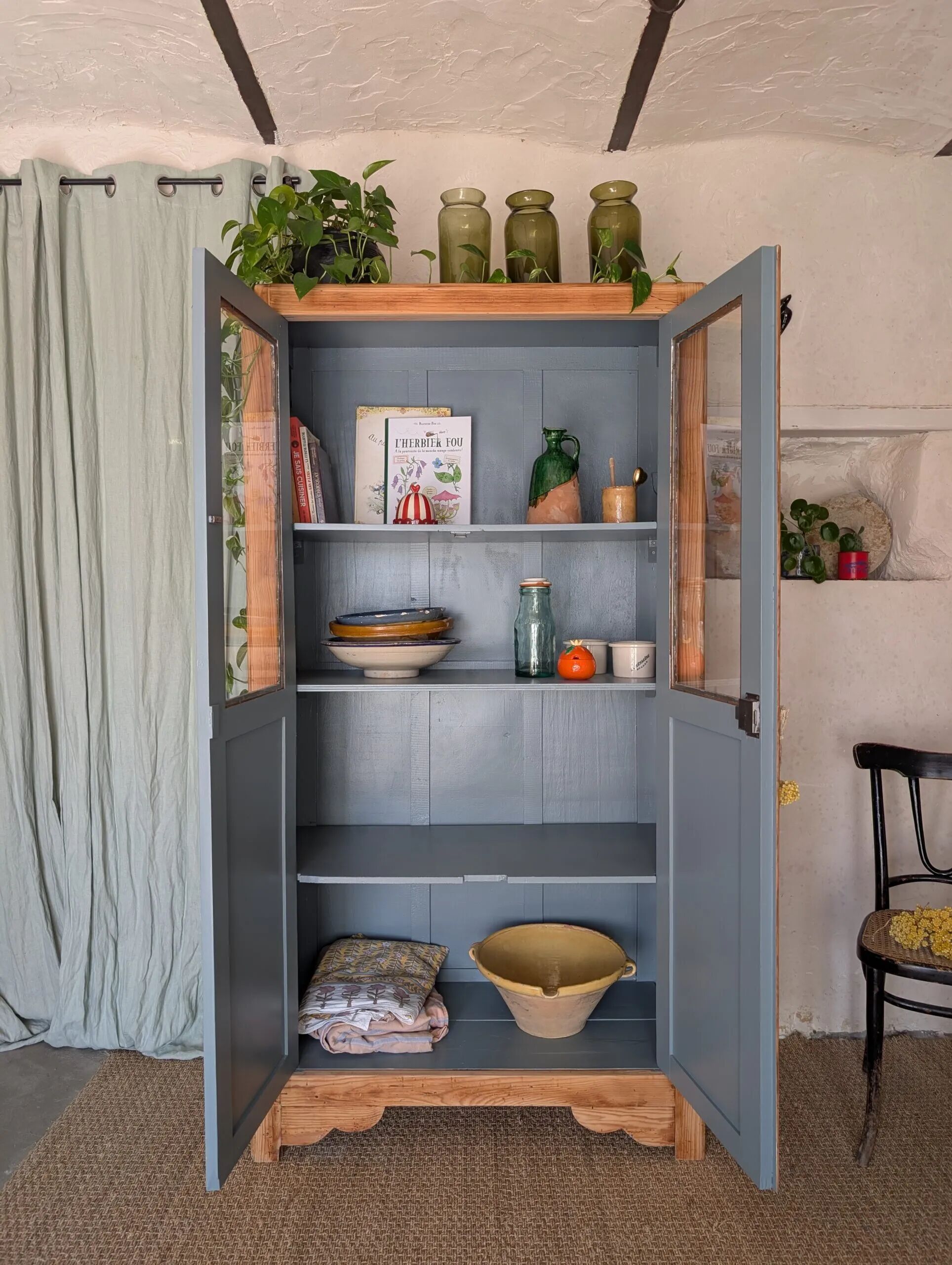 Old glass-fronted wooden library – blue interior