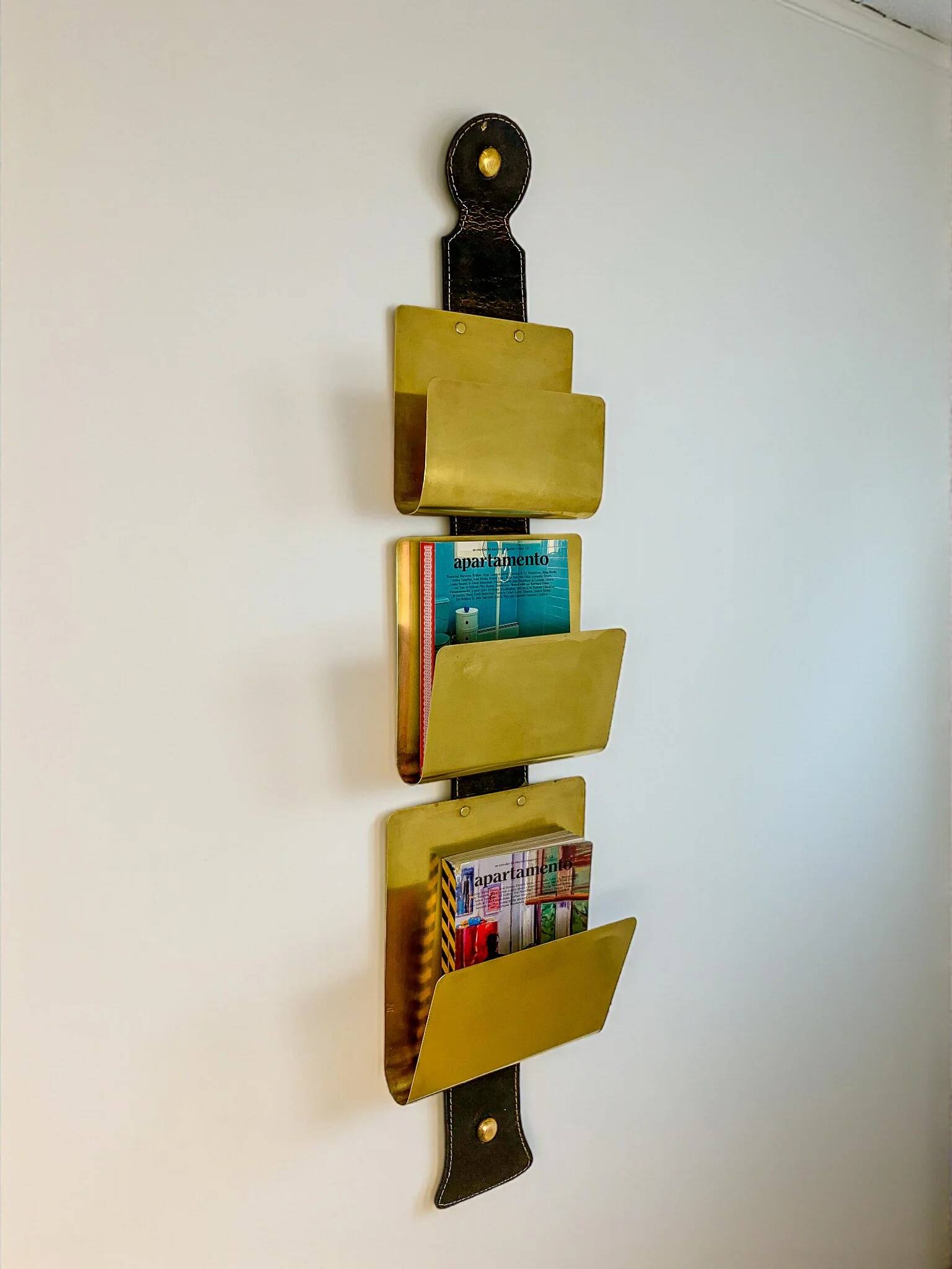 Valenti brass & leather wall-mounted magazine rack, Spain, 1970s