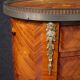 Pair of oval bedside tables in marquetry from the 20th century.