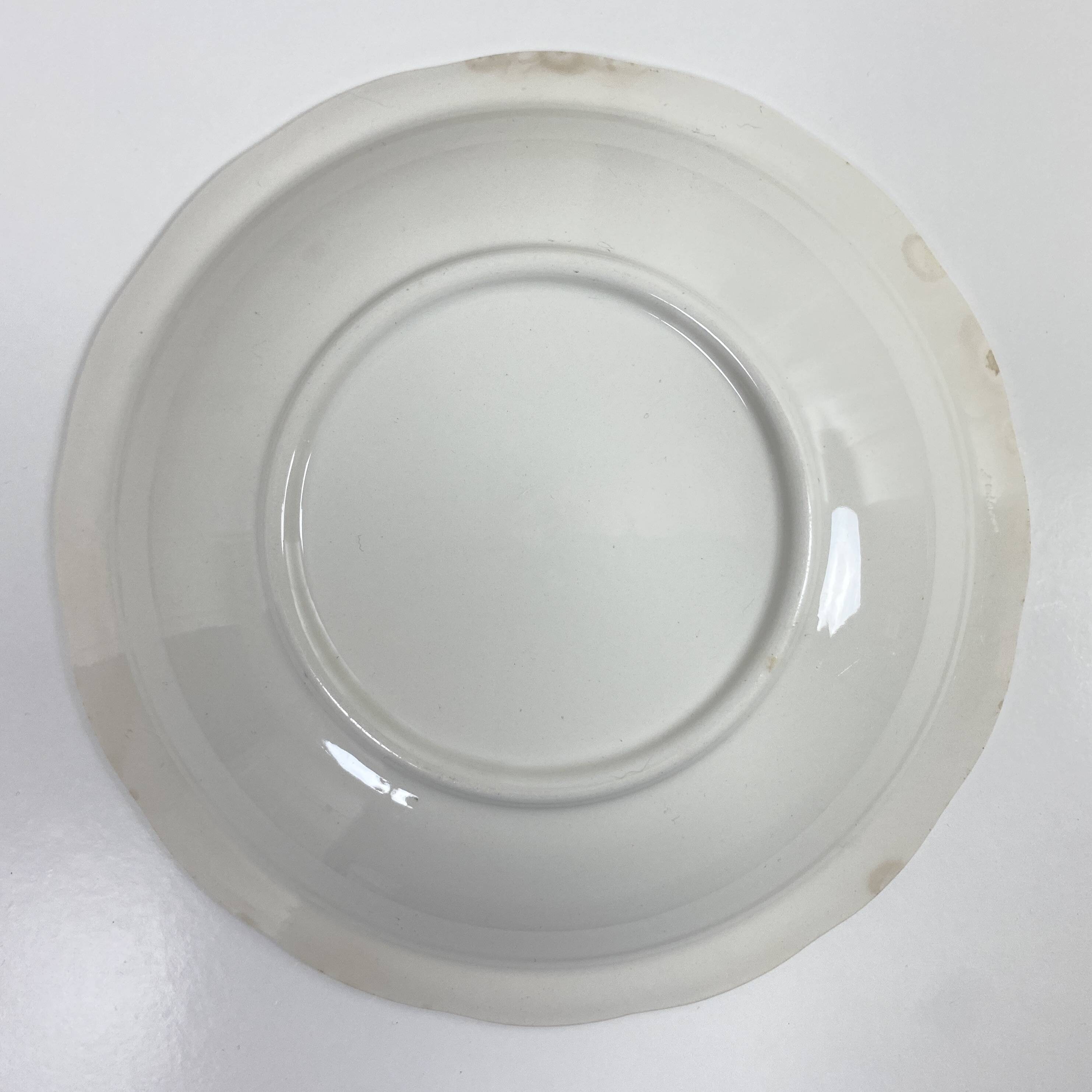 Set of two matching soup plates, one plain and one decorated