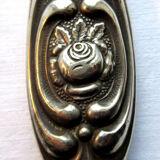 Art Nouveau hand-facing, mirror in repulsed silver frame, rose decoration 14x27cm