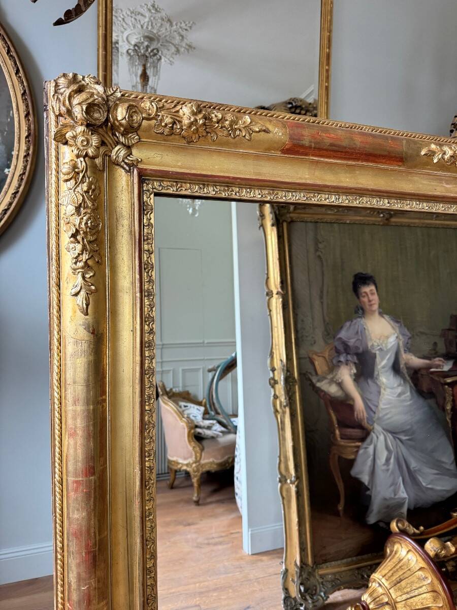 Restoration period mirror in gilded wood from the Napoleonic III era, 165 cm x 130 cm.
