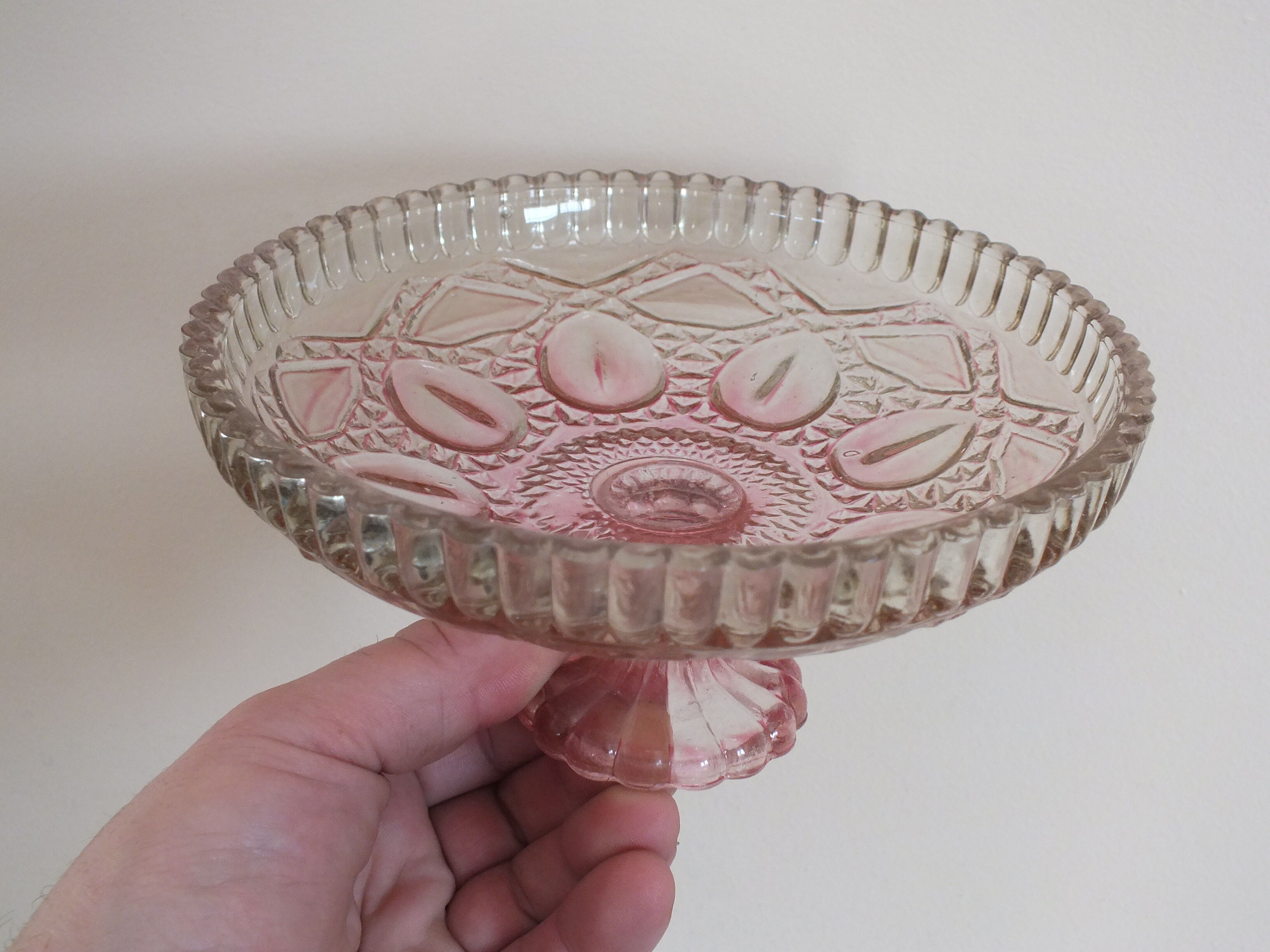 Small pink tinted molded crystal display cup