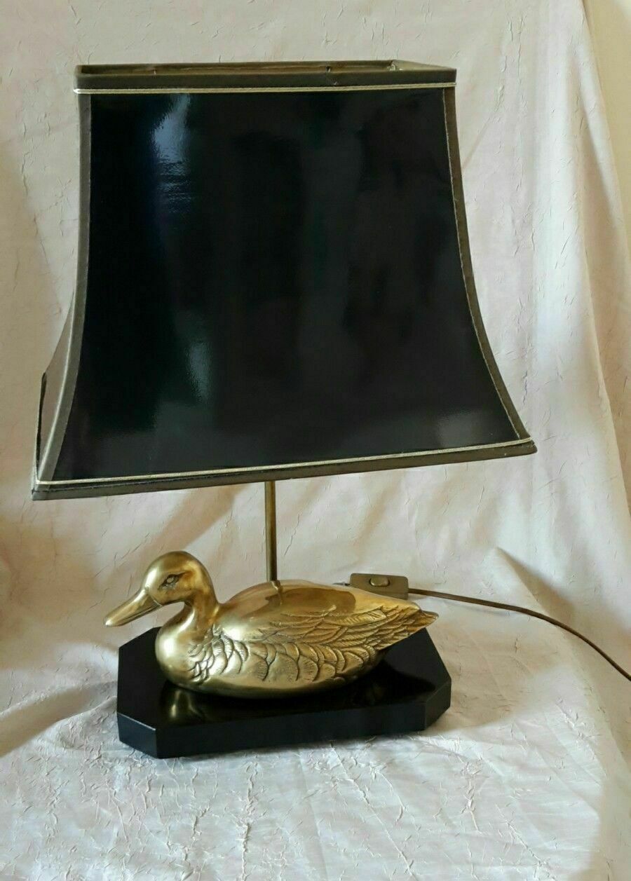 Lamp with brass duck on lacquered wood base