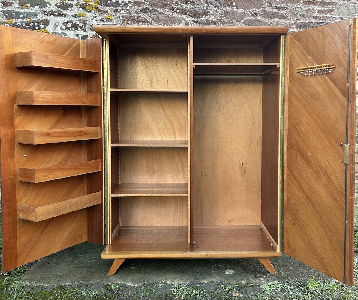Mid-century wardrobe from the 1960s in wood, with a chevron front and tapered legs.