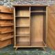 Mid-century wardrobe from the 1960s in wood, with a chevron front and tapered legs.
