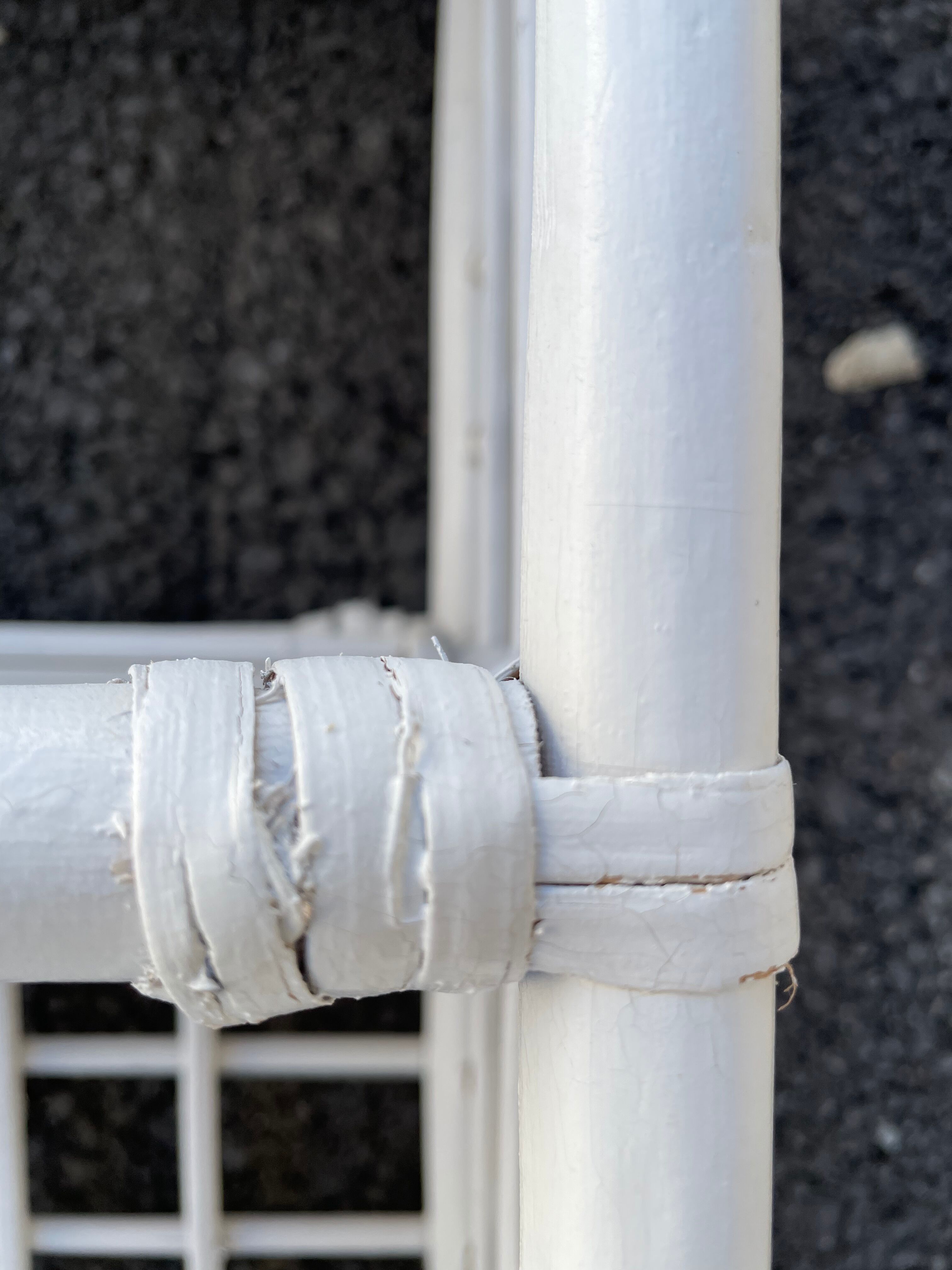 White rattan shelf with braces
