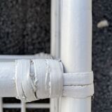 White rattan shelf with braces