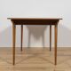 Mid-century teak extending dining table from McIntosh, UK.