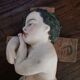 Enfant sur la croix en plâtre polychrome