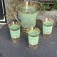 Serve an orangeade, a carafe and 3 glasses in green granite with golden trim.