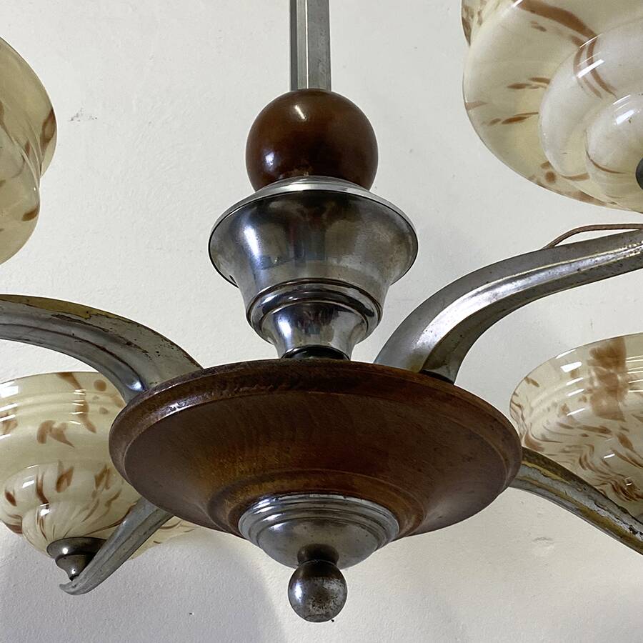 Art Deco chandelier in wood, chrome metal, and glass.