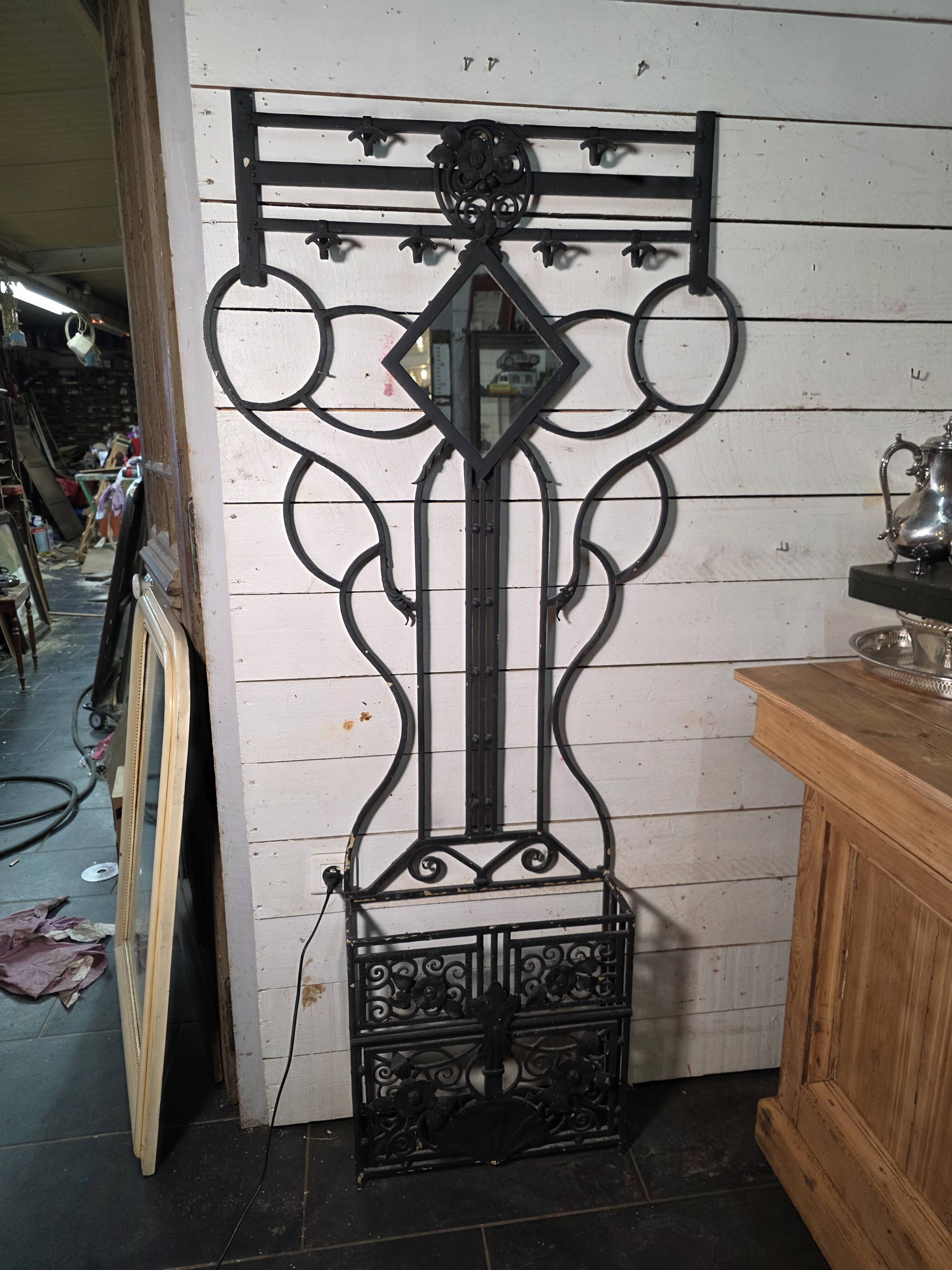 Art Deco coat rack wardrobe in wrought iron from the 1930s.