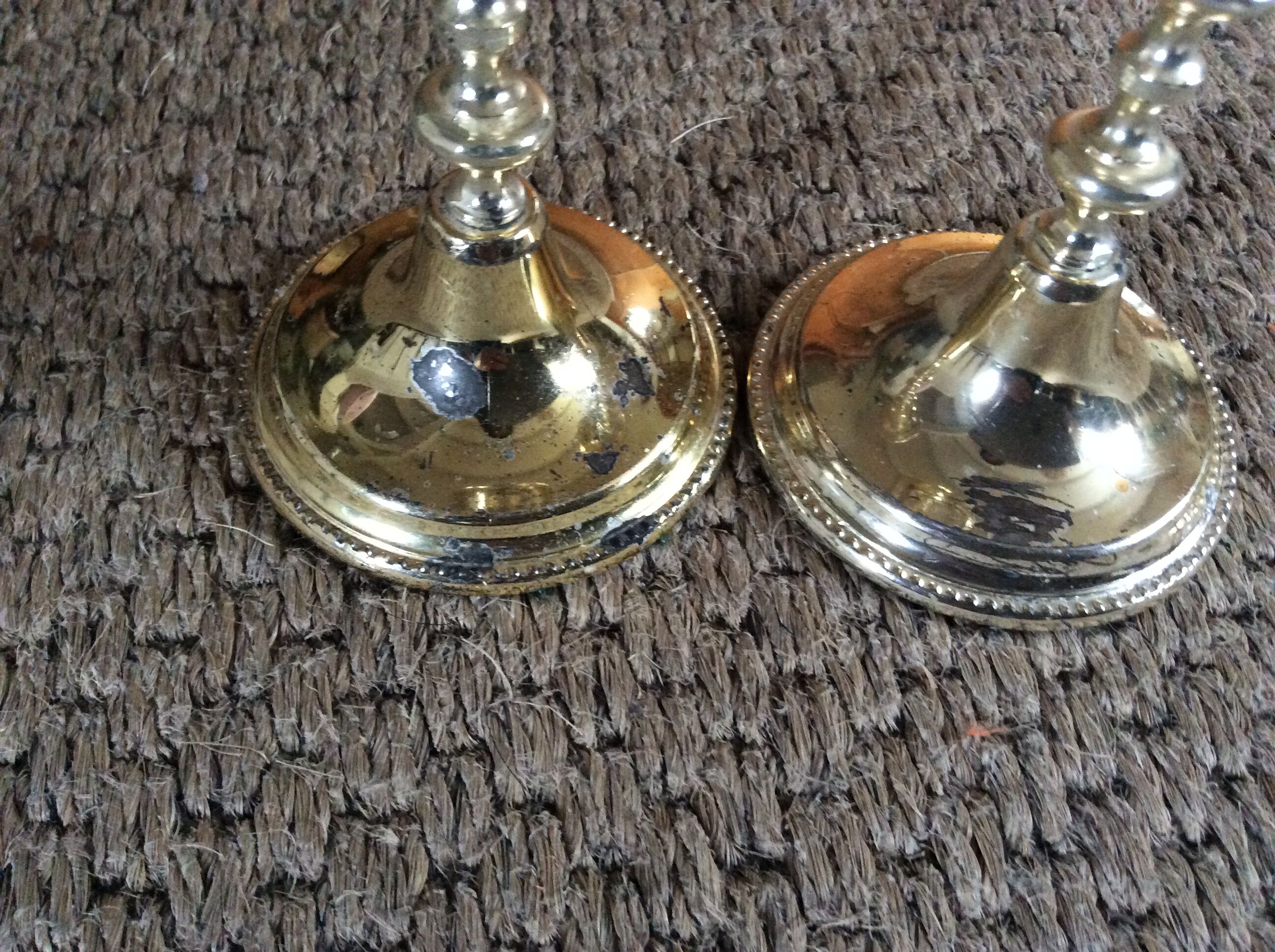 Pair of gold metal candle holders