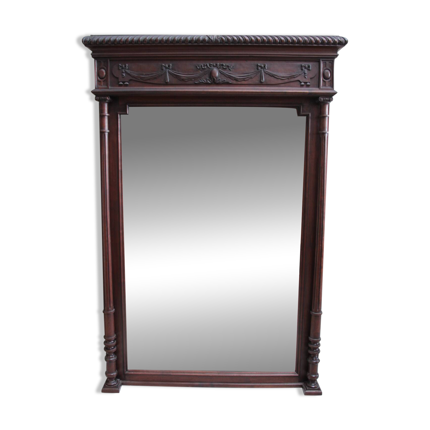 Imposing beveled mirror with wooden frame