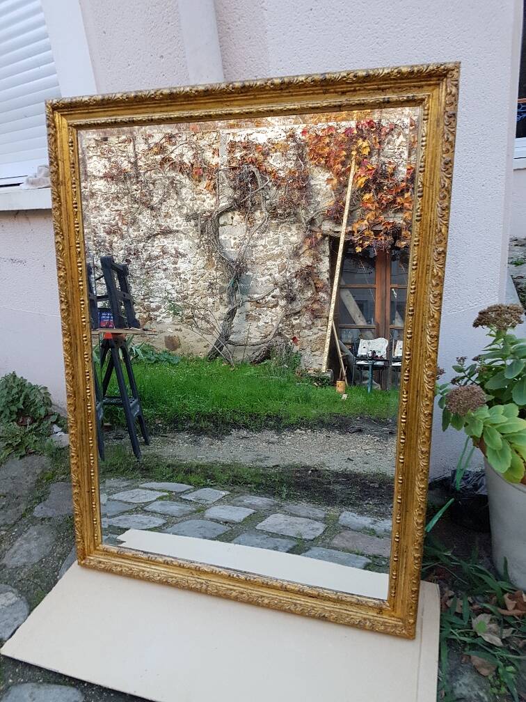 Grand golden mirror in louis xvi style