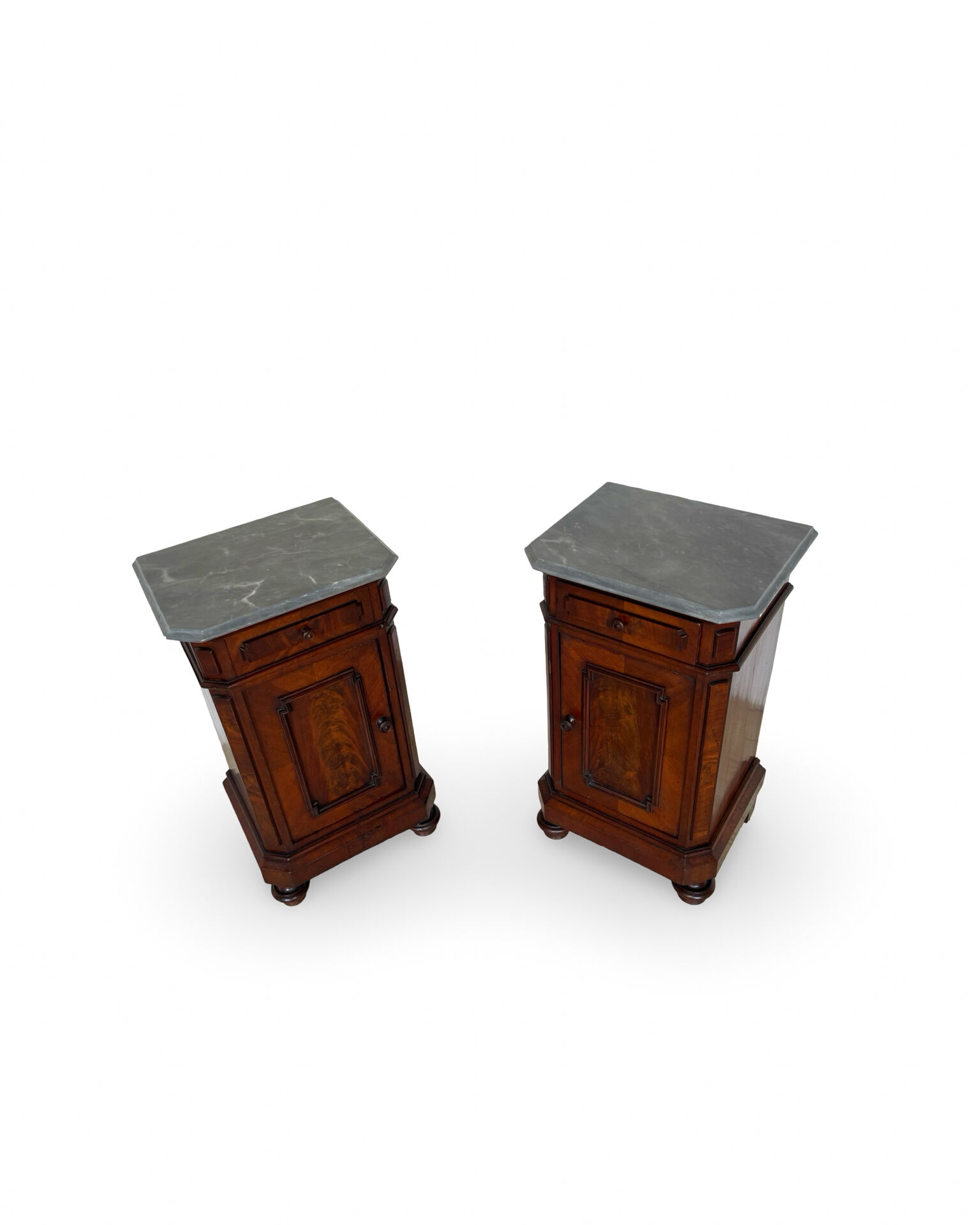 A pair of antique walnut bedside tables from the 1890s.