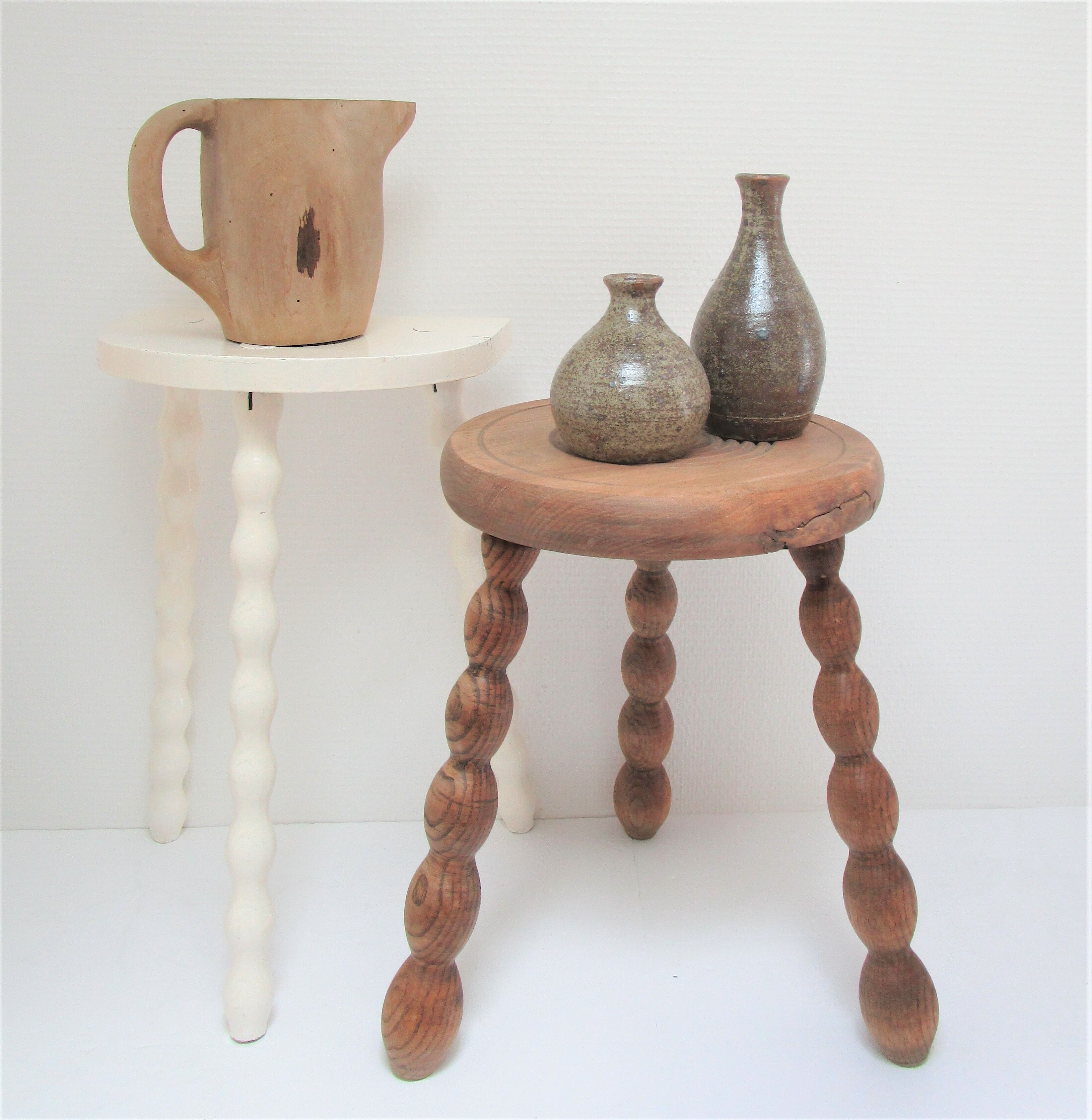 Two vintage tripod solid wood stools
