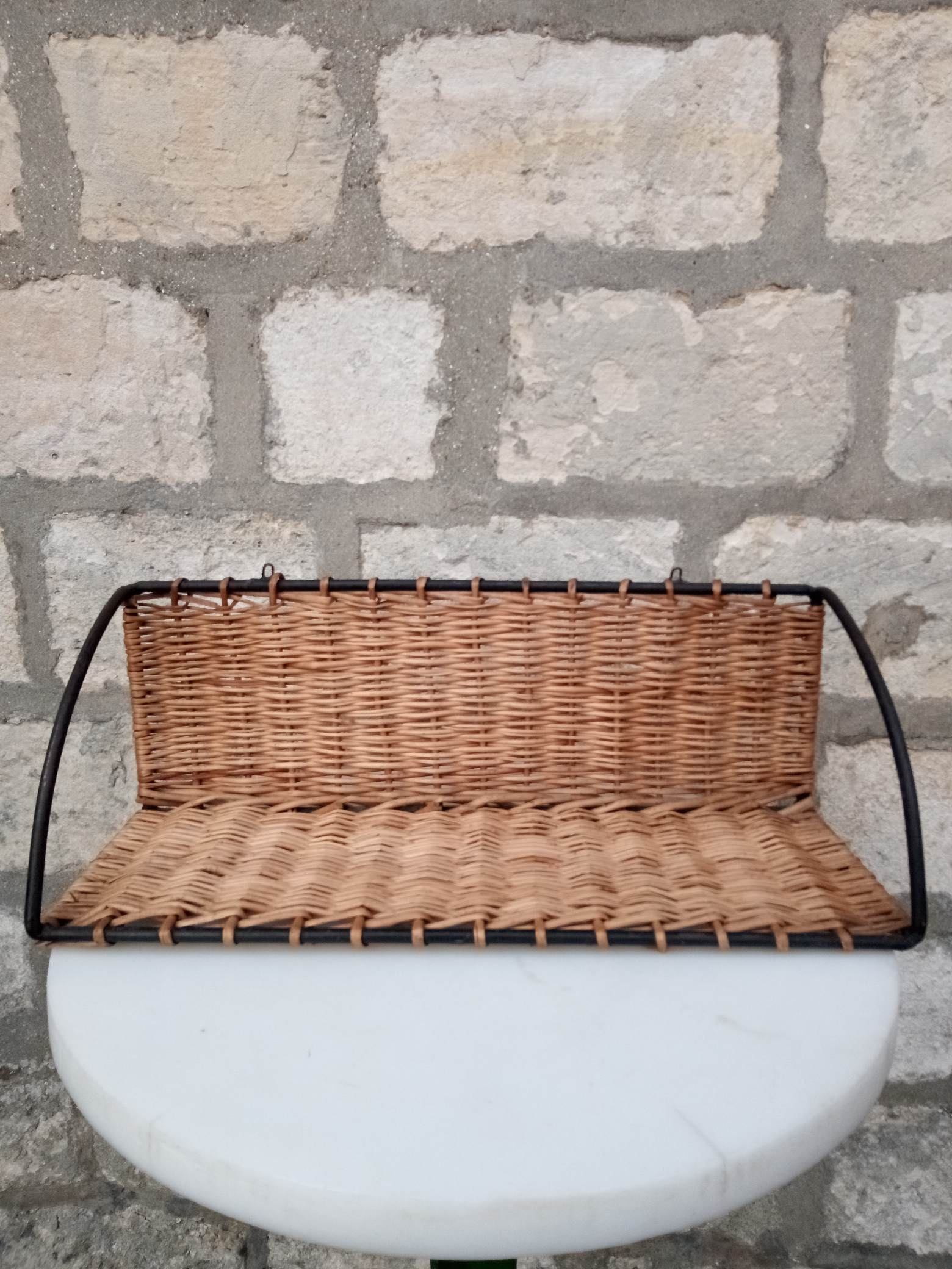 Rattan and steel shelf