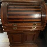 Antique solid wood secretary with a drop-down cylinder compartment.