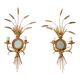A pair of 1950s wall sconces in gold leaf metal.