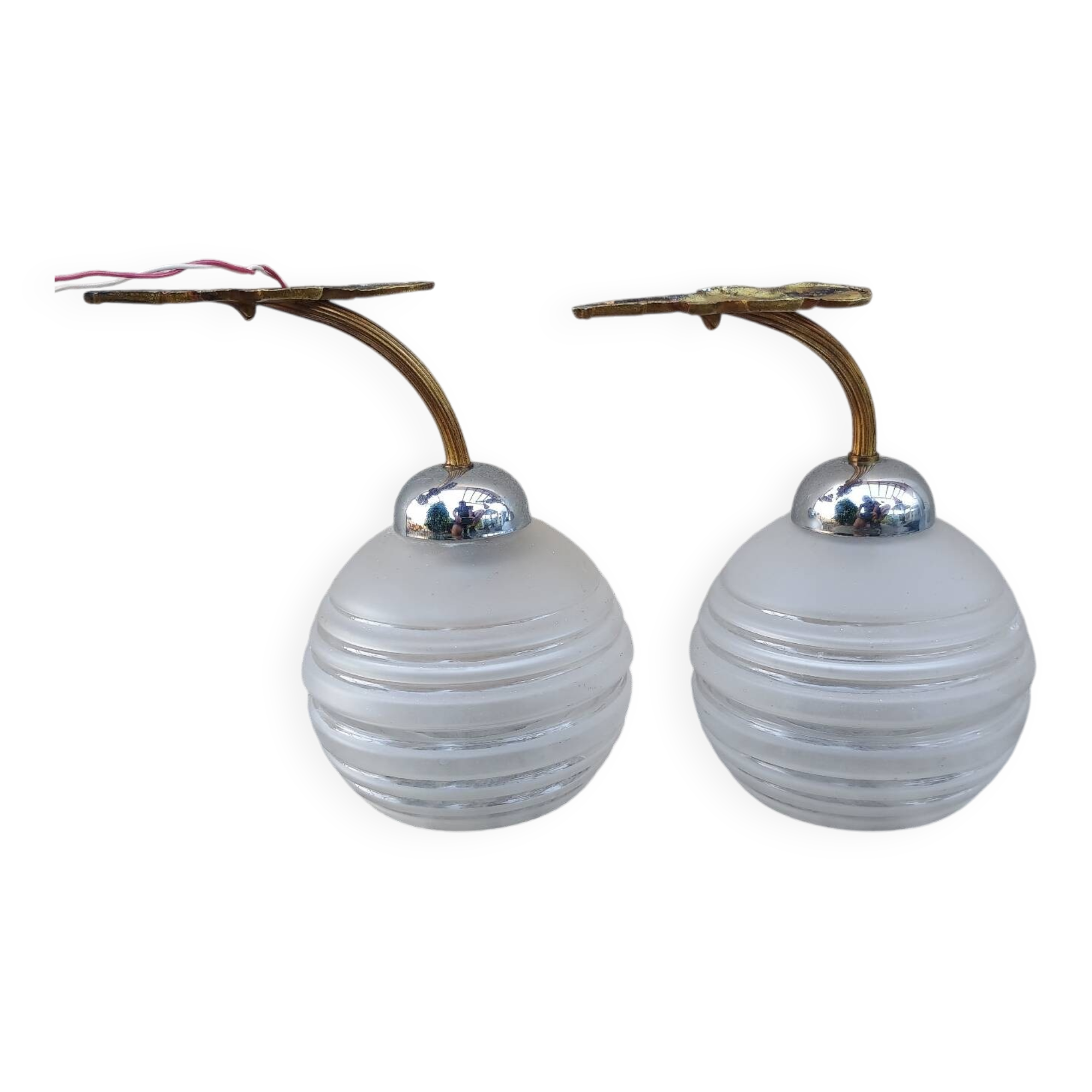 Pair of frosted glass wall lights with brass attachments, circa 1970