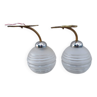 Pair of frosted glass wall lights with brass attachments, circa 1970