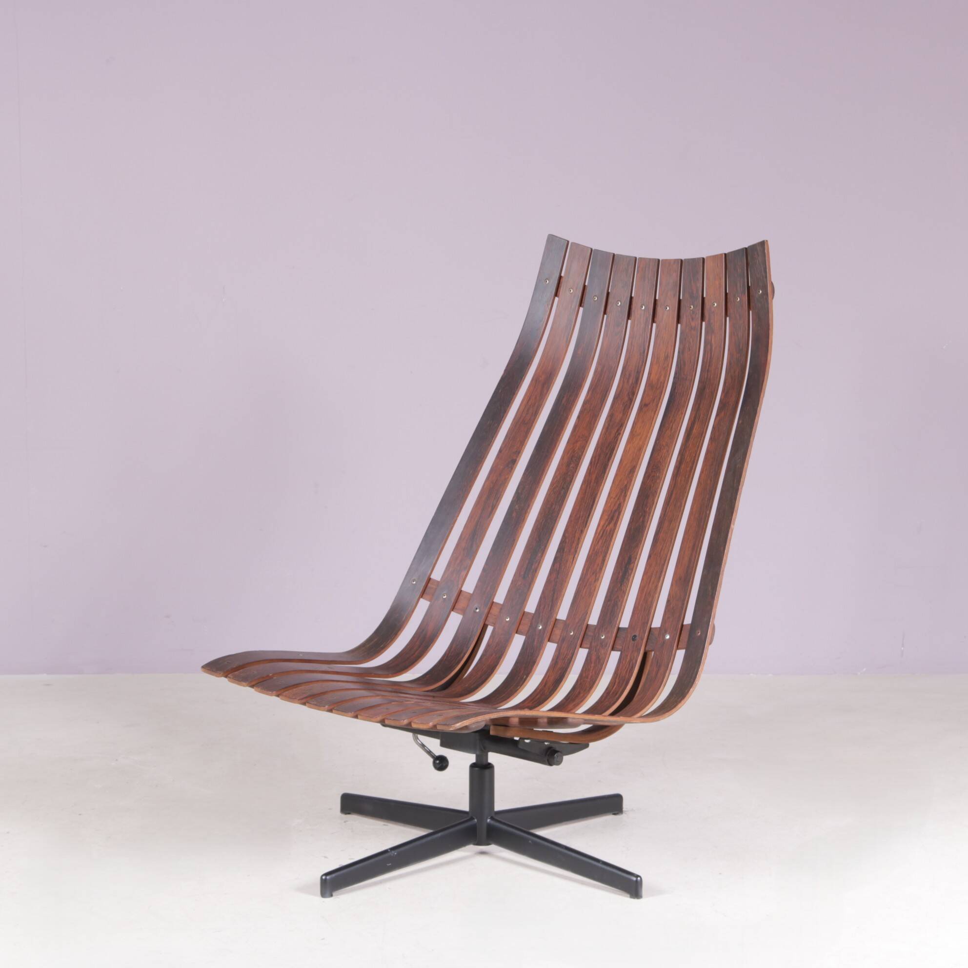 Lounge chair Rosewood with black metal cross base Hans Brattrud 1960s