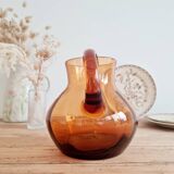 Antique amber glass pitcher