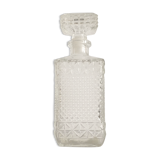 Bottle of whisky in chiseled glass
