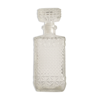 Bottle of whisky in chiseled glass