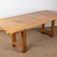 Large extendable dining table in solid oak by Guillerme and Chambron.